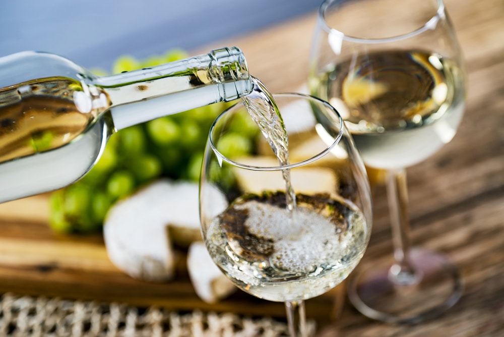 White wine being poured at the top wineries in Virginia